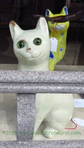 Antique cat sculpture in an auction house. 