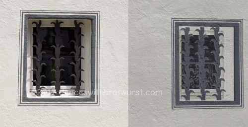 Two photos of the same house--the left is an iron grate covering a window, and the right is a painted-on window with grate to fool your eye into  seeing a symmetrical house. I love it.